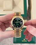 Rolex oyster gold green